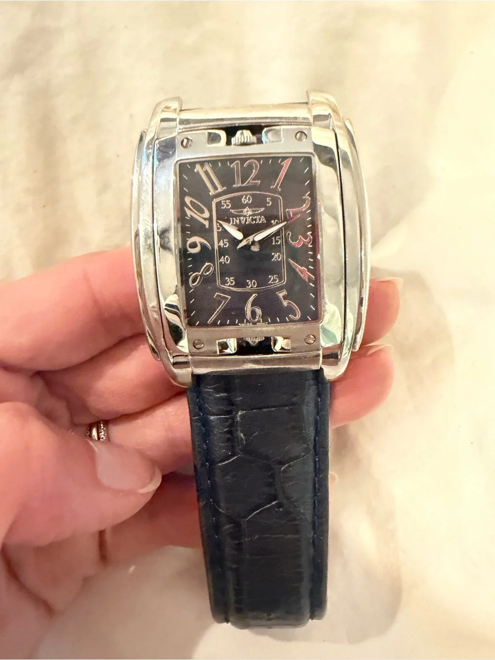 Invicta Men’s Silver Case Watch with Black Leather Strap Model 4224